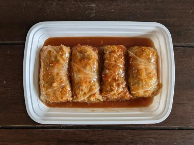 Pork, beef and rice cabbage rolls with a quick farm salad